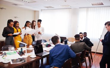 Diverse business people on a meeting at round table. Diverse business people on a meeting at round table.
