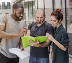 people-standing-with-papers-outdoors