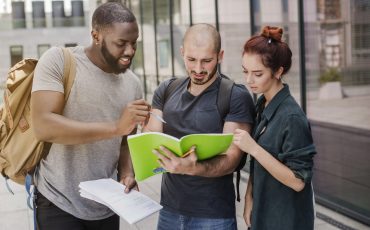 people-standing-with-papers-outdoors people-standing-with-papers-outdoors