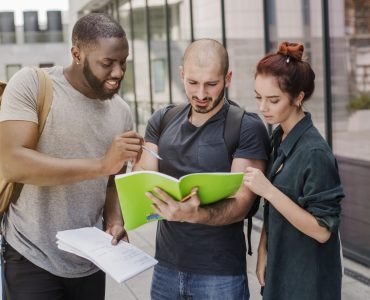 people-standing-with-papers-outdoors people-standing-with-papers-outdoors