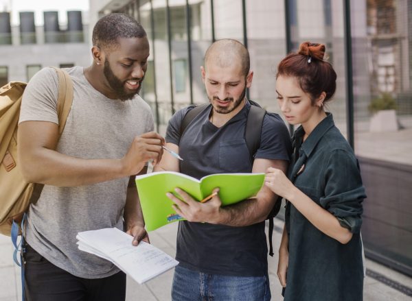 people-standing-with-papers-outdoors people-standing-with-papers-outdoors