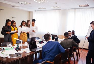 Diverse business people on a meeting at round table.