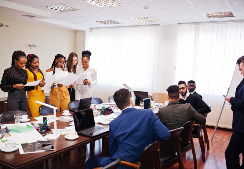Diverse business people on a meeting at round table.