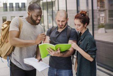 people-standing-with-papers-outdoors