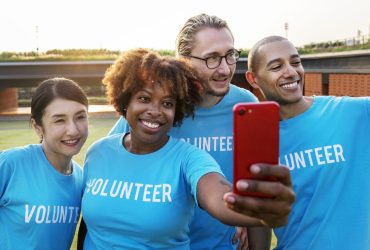Diverse volunteers taking a selfie together
