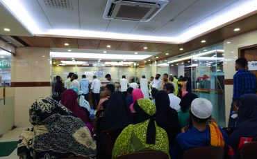 Row of people of various ages patient waiting for see doctor Row of people of various ages patient waiting for see doctor